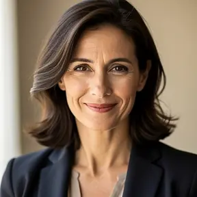 Close-up portrait of a French woman in her early 40s, confident and approachable expression, neutral background, soft natural light, editorial headshot photography, high resolution, shallow depth of field
